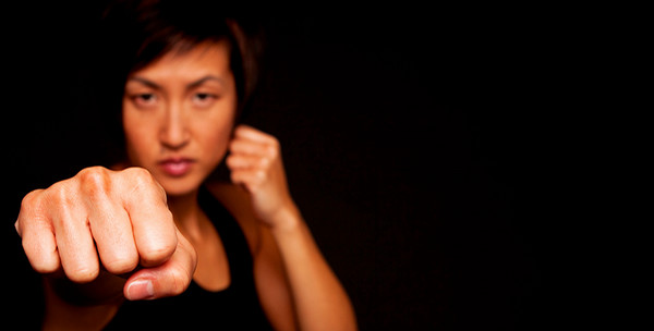 woman punching toward camera